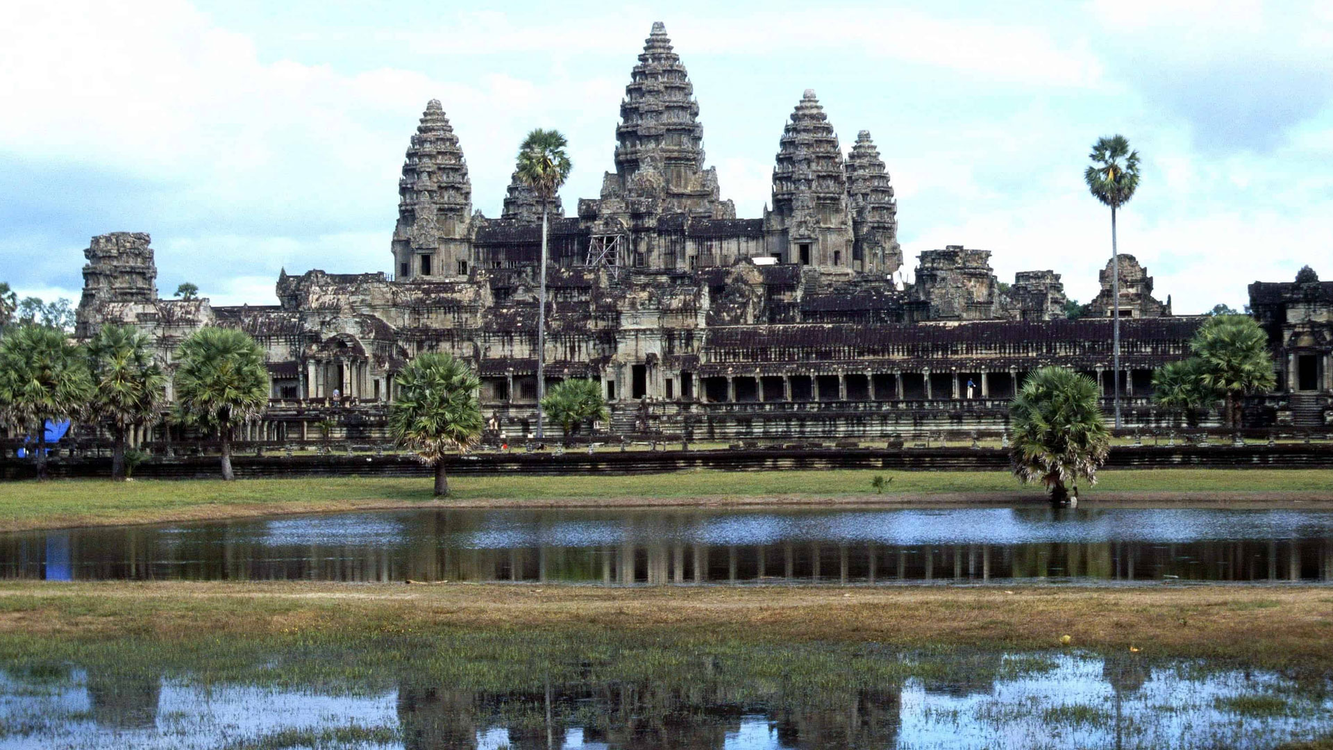 A panoramic view of Angkor Wat temple complex at sunset, representing the top attraction in Cambodia