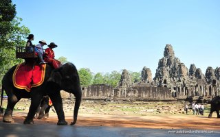 Riding elephants in Banteay Srei