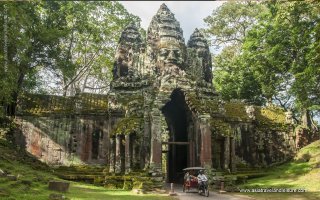 The main transport Tuk Tuk at northern gate of Angkor Thom in Siem Reap of Cambodia