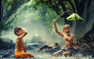 Children are playing in the Cambodia river