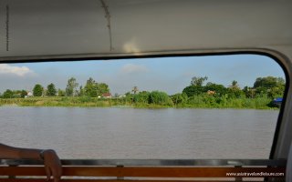 View to river bank from speed boat